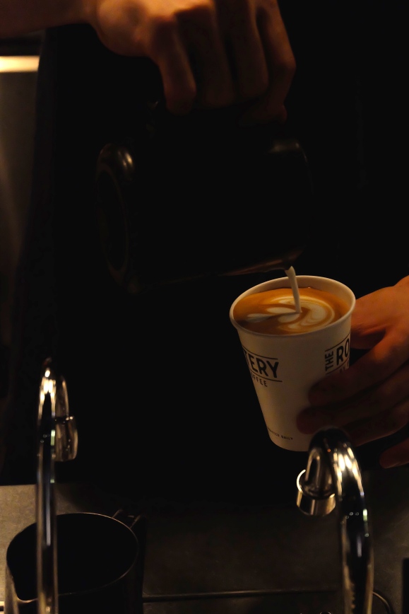 Barista Pouring Latte Art at The Roastery by Nozy Coffee in Shibuya Tokyo Japan
