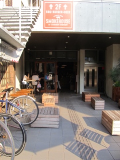 Sine shining on benches outside The Roastery by Nozy Coffee in Shibuya Tokyo Japan