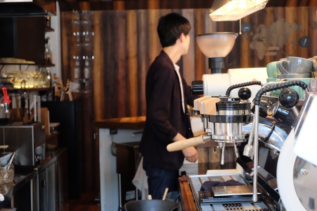 Close up of La Marzocco Strada with Barista at Unlimited Coffee Bar in Narihira Tokyo Japan